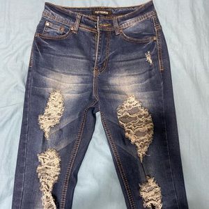 ripped dark blue jeans